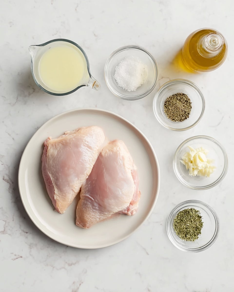 The image shows two raw pink chicken pieces placed in the center of a white plate on a white marbled surface. To the left of the plate, there are two clear glass measuring cups, one with a light yellow liquid and the other with a white liquid. To the right of the plate, there is a small tan oil bottle at the top, followed by three small clear glass bowls arranged vertically. The top bowl contains white salt and black pepper, the middle bowl holds green dried herbs, and the bottom bowl has minced garlic. The whole setup is neat and evenly spaced. Photo taken with an iphone --ar 4:5 --v 7