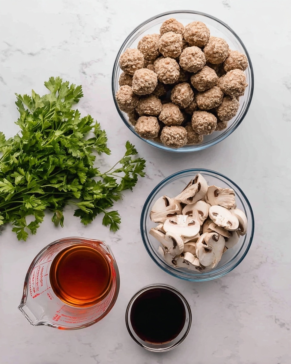 A top view shows a set of food ingredients on a white marbled surface. At the center, there is a clear bowl filled with many small, round meatballs that are light brown and have a rough texture. Below and to the right of it, another clear bowl holds sliced mushrooms with light cream caps and darker gills, showing a fresh texture. To the left of the bowls, there is a bunch of green parsley with leafy, fresh stems resting directly on the surface. Below the parsley, a clear glass measuring cup is filled halfway with a reddish-brown liquid. Next to the measuring cup, there is a small clear round bowl filled with a dark brown liquid. The arrangement is neat, with the colors contrasting well against the clean white marbled surface. Photo taken with an iphone --ar 4:5 --v 7