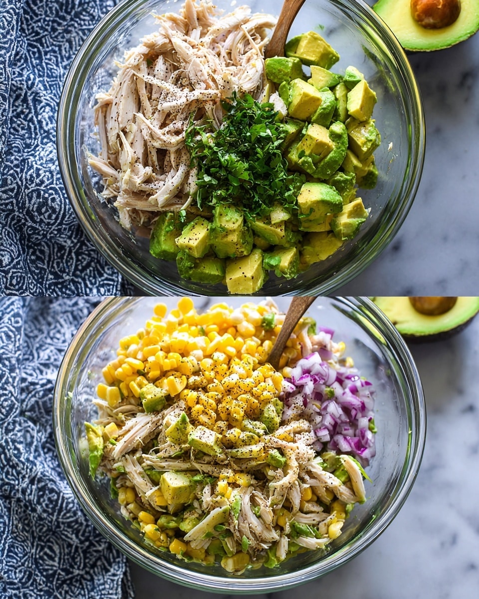 The first image shows a clear glass bowl with four main layers: shredded light beige chicken on the bottom left, chopped bright green avocado pieces on the top right, small bright yellow corn kernels on the bottom right, and finely chopped purple-red onion on the bottom center. There is also a pile of finely chopped dark green herbs near the avocado. Black pepper is sprinkled on top of all the ingredients. The bowl sits on a white marbled surface with a patterned blue and white cloth beside it. The second image shows the same bowl with all the ingredients mixed together, creating a chunky salad of light beige chicken, green avocado slices, yellow corn, and purple-red onion pieces, with visible black pepper sprinkled around. A wooden spoon is in the bowl, and behind it, there is half a green avocado with the seed still inside. The background is a white marbled surface. photo taken with an iphone --ar 4:5 --v 7
