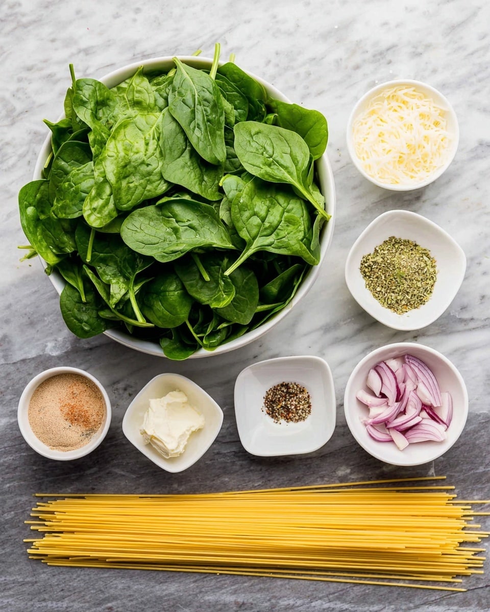 A large white bowl filled with fresh, bright green spinach leaves is placed on the left side, while to the right are several small white square and round bowls each holding different ingredients: light brown garlic powder, pale green seasoning, finely chopped purple shallots, black pepper, a dollop of white mayonnaise, finely minced garlic, and finely grated pale yellow cheese. Below these bowls, a small bunch of uncooked yellow spaghetti strands is neatly spread out. All items rest on a white marbled surface photo taken with an iphone --ar 4:5 --v 7