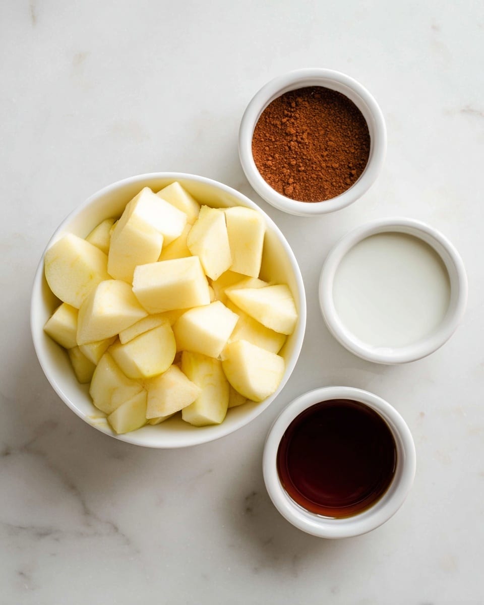 A top view of a white bowl filled with pale yellow apple chunks in the center, surrounded by three small white bowls placed on a white marbled surface; one contains fine brown cinnamon powder at the top right, another has clear white liquid at the middle right, and the last one holds dark amber syrup at the bottom right photo taken with an iphone --ar 4:5 --v 7