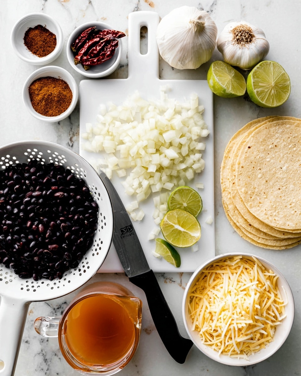 The image shows a white cutting board at the center with a pile of small white onion cubes and four lime wedges resting near the top left edge. A black-handled knife lies diagonally on the cutting board, partly on the onions. Around the board, there are ingredients arranged on a white marbled surface: at the bottom left, a white colander holding black beans; above it, a small white bowl with three spices in brown, red, and dark brown colors; above and to the left of the cutting board, two small white ramekins, one containing a dark brown paste and the other some dried red chili pods; at the top, a whole garlic bulb and a separated garlic clove; to the right of the cutting board, a stack of white corn tortillas showing some pattern; below the tortillas, a clear glass measuring cup filled with an orange-brown liquid; and at the bottom right, a white bowl filled with shredded light yellow cheese in thin strands. The photo taken with an iphone --ar 4:5 --v 7
