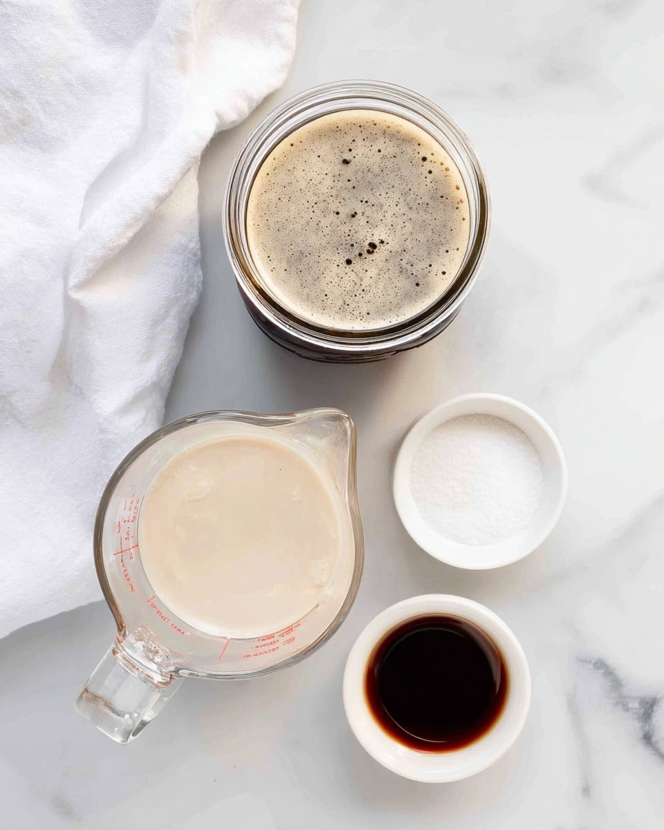 The image shows a top-down view of four containers on a white marbled surface with a white cloth on the left. At the top is a clear glass jar filled with dark brown coffee that has light frothy bubbles on top. Below it, slightly to the left, is a clear measuring cup filled with a light beige creamy liquid. To the right of the measuring cup are two small white bowls; the top one contains white granulated sugar, and the bottom bowl holds a dark brown, thick liquid, likely vanilla extract. The scene is bright and clean with a simple, fresh look. photo taken with an iphone --ar 4:5 --v 7