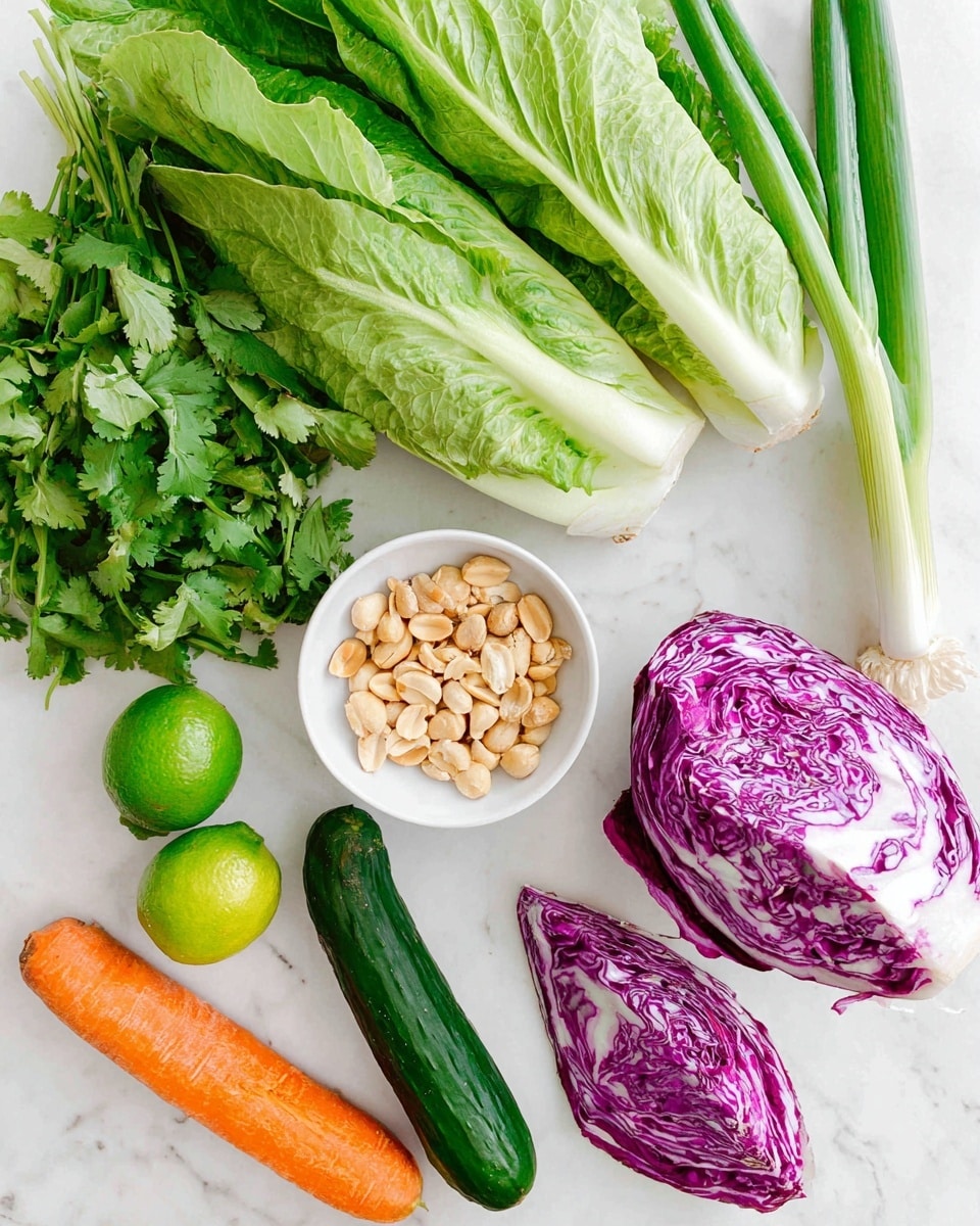 The image shows various fresh ingredients arranged on a white marbled surface. There are large green romaine lettuce leaves at the top, with a green onion lying beneath them. Below, a small white bowl filled with roughly chopped peanuts is placed near the center. To the right of the bowl, there is a half piece of purple cabbage with white veins visible inside. On the left side, a whole lime and some green cilantro leaves are visible, with an orange carrot placed horizontally nearby. At the bottom center, a green cucumber is also present. The colors are bright and fresh, displaying a natural and healthy mix of vegetables and nuts. Photo taken with an iphone --ar 4:5 --v 7