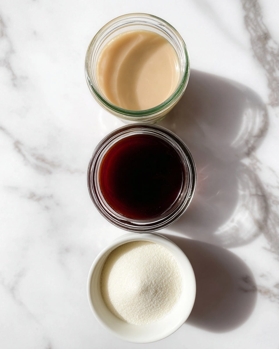 The image shows three containers on a white marbled surface, arranged in a vertical line. At the top is a clear glass jar filled with a smooth, light beige liquid. Below it is another clear glass jar containing a dark brown liquid that looks thick and glossy. At the bottom is a small white bowl filled with a mound of fine white powder, creating a strong contrast against the bowl. The lighting is bright and natural, and the focus is sharp, highlighting the textures and colors of each item. photo taken with an iphone --ar 4:5 --v 7