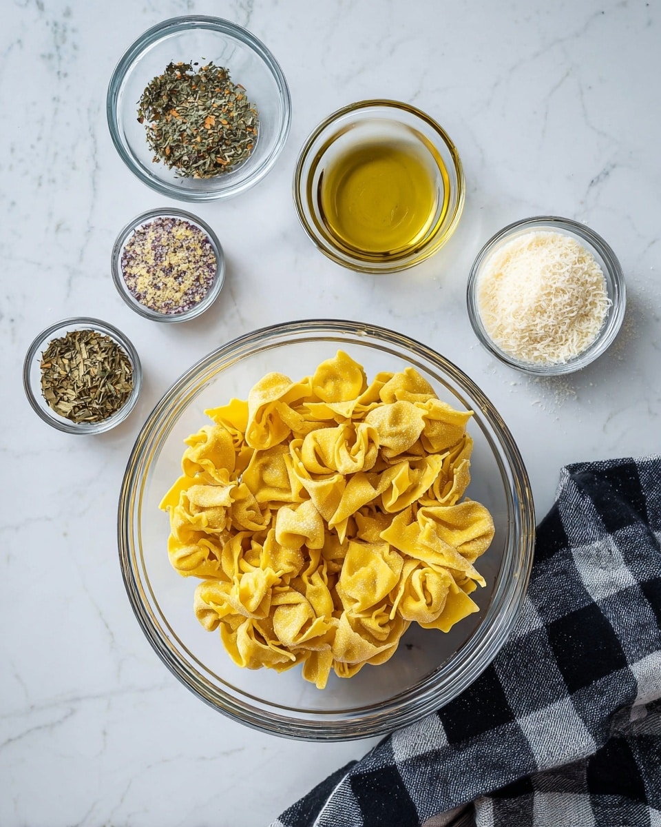 A clear glass bowl filled with yellow folded pasta sits in the center on a white marbled surface. Surrounding it in small clear glass bowls are dried herbs with green and brown flakes at the top left, golden olive oil at the top right, white powder at the bottom left, and grated parmesan cheese with a light beige color at the right. A black and white checkered cloth napkin is placed on the bottom right side near the glass bowl. Photo taken with an iphone --ar 4:5 --v 7