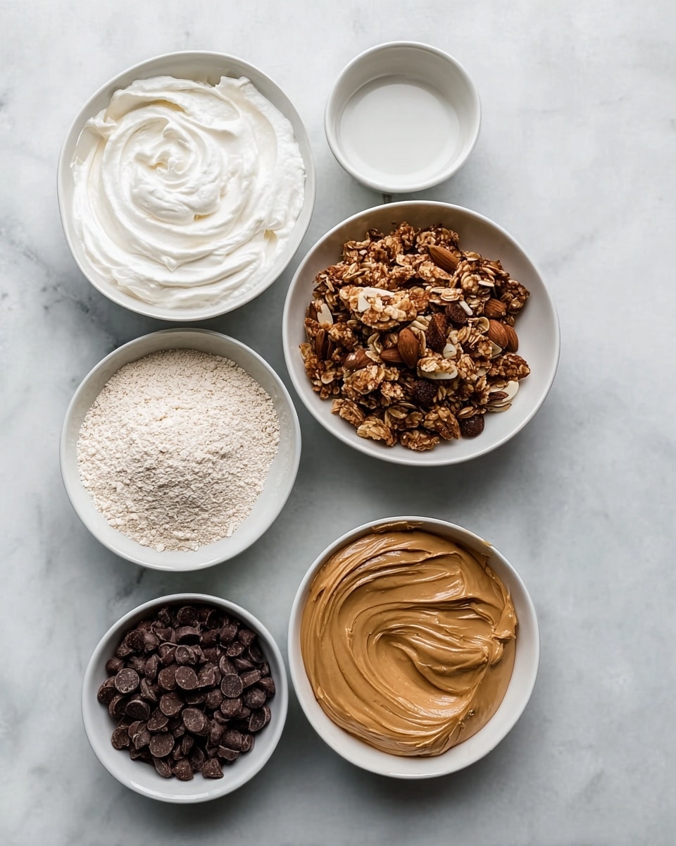 The image shows six white bowls arranged vertically on a white marbled surface with space on the right. From top to bottom: the first large bowl contains soft, white whipped cream with swirls on top; the second small bowl is empty; the third medium bowl holds crunchy, dark brown granola with a mix of almonds and other nuts; the fourth medium bowl is filled with a light beige powder, likely flour; the fifth small bowl has dark brown chocolate chips; the sixth medium bowl contains creamy, smooth peanut butter with swirl marks on its surface. Photo taken with an iphone --ar 4:5 --v 7