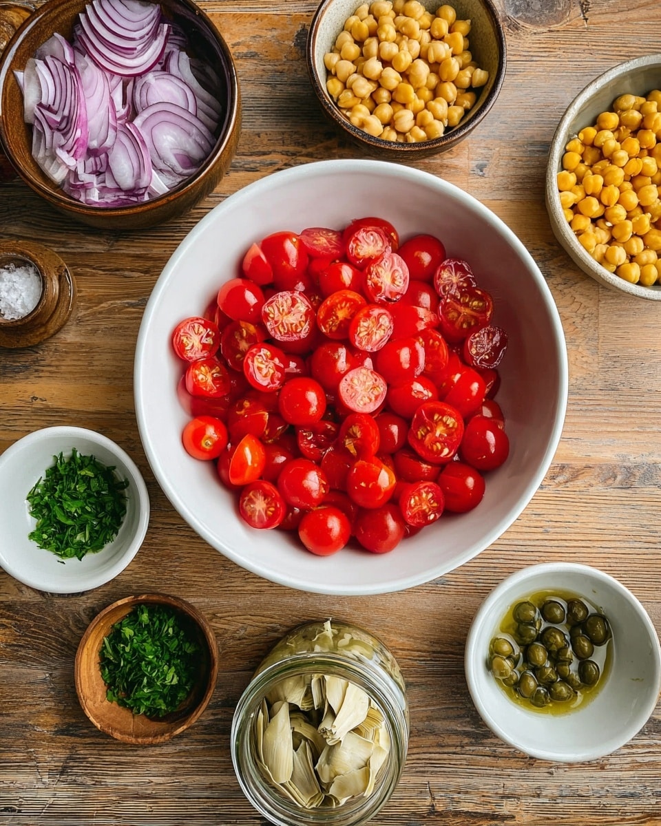The image shows a white bowl in the center filled with halved bright red cherry tomatoes, their juicy interiors visible. Around the bowl, arranged neatly on a wooden surface, are small containers holding different ingredients: thinly sliced purple onion rings in a brown bowl at the top left, small round yellow chickpeas in a white bowl at the top right, chopped green herbs on the bottom left and bottom right in small white and wooden bowls, and a few green capers in a small white bowl near the center left. At the bottom center, there is a small jar with pale artichoke hearts soaked in liquid, and another jar with green herb-infused oil. The whole setting is simple and colorful, with a focus on fresh, raw ingredients. Photo taken with an iphone --ar 4:5 --v 7