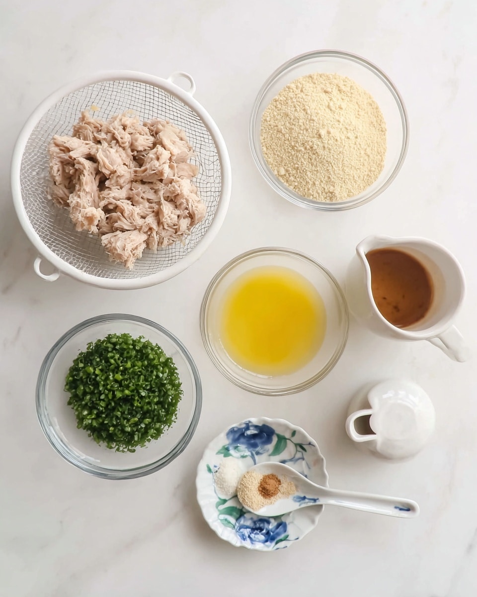 A top view of six small bowls and a white mesh strainer arranged on a white marbled surface. The white mesh strainer is on the left side, filled with light beige cooked shredded meat. Above it is a clear round bowl with a light tan powder. Below the powder bowl is another clear bowl with a bright yellow beaten mixture. Below and slightly left is a clear bowl filled with bright green chopped herbs. On the bottom right is a small white spoon with blue flower patterns holding two small piles of minced white garlic and light brown powder. Next to it is a small white pitcher with a brown liquid inside. photo taken with an iphone --ar 4:5 --v 7