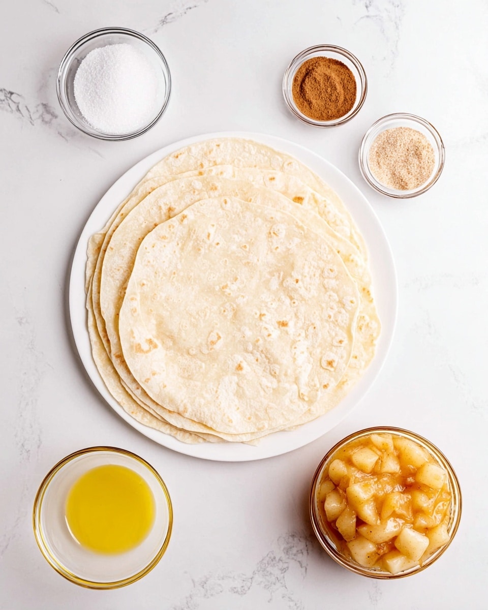 The image shows a white plate stacked with five to six soft, light beige tortillas slightly overlapping each other in the center. Around the plate on a white marbled surface, there are four glass bowls holding different ingredients: a small bowl with white granulated sugar at the top left, a small bowl with light brown cinnamon powder at the top right, a small bowl with golden melted butter at the bottom left, and a larger bowl with chunky, light orange cooked apples mixed with syrup at the bottom right. The setup is clean and bright, with even lighting highlighting the textures of each element. Photo taken with an iphone --ar 4:5 --v 7
