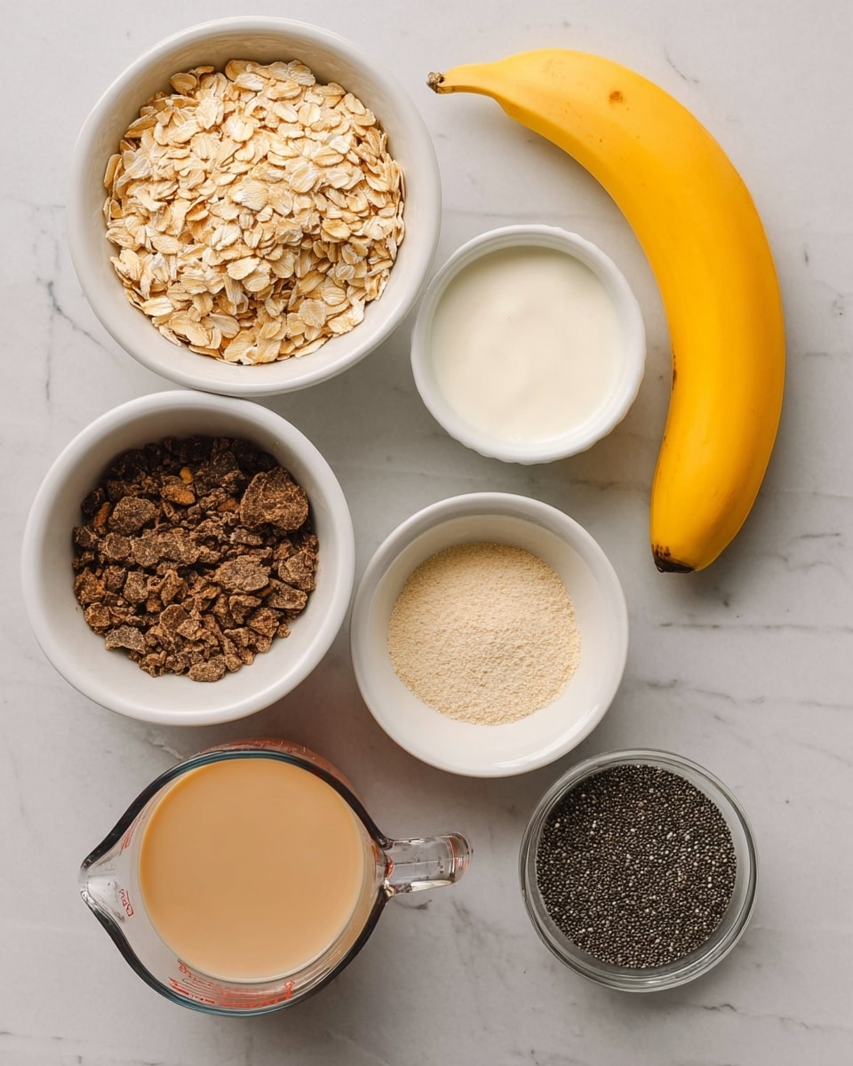 The image shows several ingredients arranged on a white marbled surface. There is a single yellow banana on the top right. Below it, a white bowl is filled with light beige rolled oats. Next to it on the left, a white ramekin holds a white creamy substance, and below it another white ramekin contains a light beige powder. A white bowl filled with dark brown crushed pieces sits at the bottom left. In the middle right, a clear glass measuring cup holds a pale beige liquid. Below it, a small white bowl is filled with black chia seeds, and at the bottom left, a small clear glass bowl contains a dark brown liquid. The photo is taken with an iphone --ar 4:5 --v 7