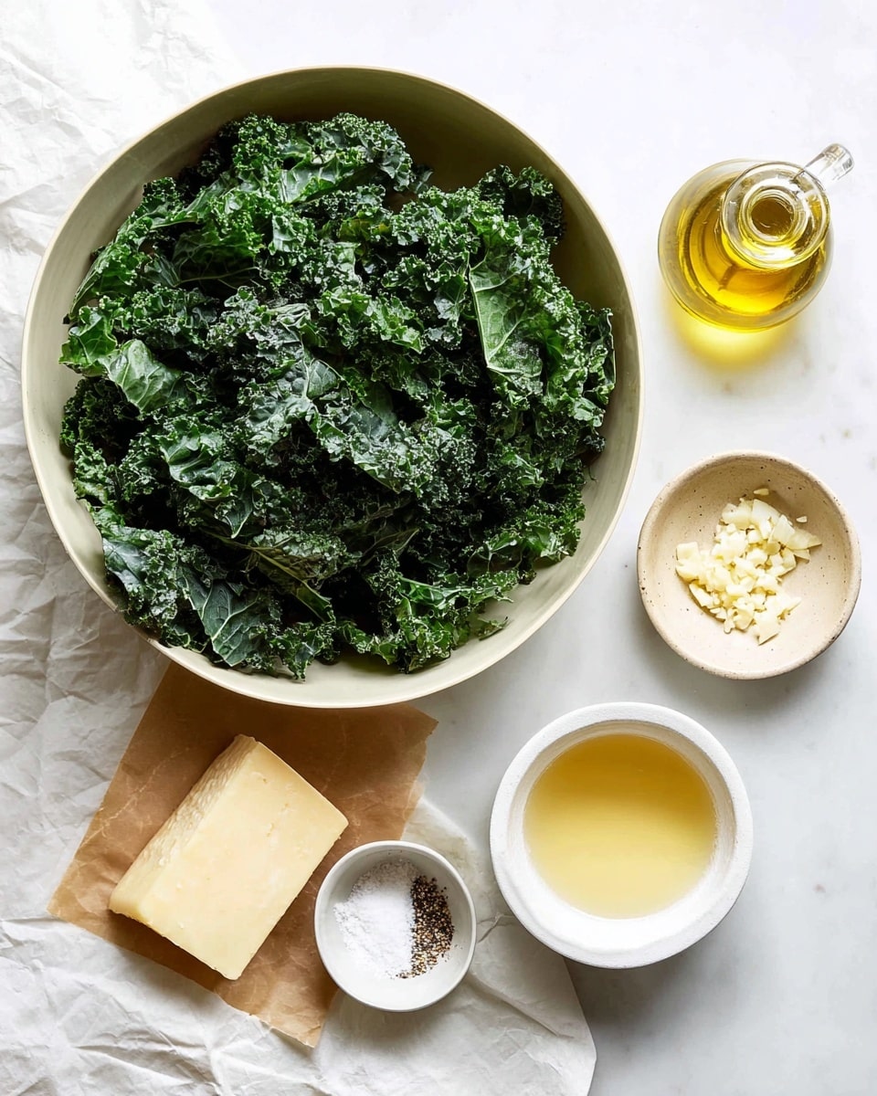 A large white bowl filled with many dark green kale leaves, rough and curly in texture, is placed on a white marbled surface. Below it, there is a small round white bowl with minced garlic on the right side, a small glass bottle filled with golden oil above it, a small round beige bowl containing salt and black pepper above and to the left, and a wedge of pale yellow cheese directly to the left of a small round white bowl with some white salt or seasoning inside. At the bottom right, a medium white bowl holds a golden-yellow liquid. The scene is bright and clean, with all items spaced neatly. Photo taken with an iphone --ar 4:5 --v 7