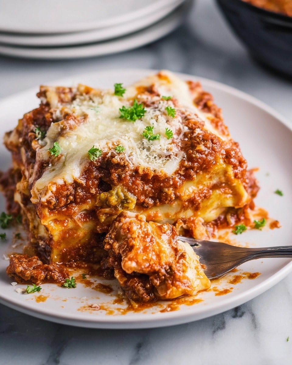 A thick square of lasagna sits on a white plate with a layered texture made of wide, pale yellow pasta sheets, rich red tomato meat sauce with small brown meat bits, and melted white cheese that is slightly browned on top. The top layer has a sprinkling of shredded pale yellow cheese and small pieces of bright green parsley. A silver fork holds up a portion showing gooey cheese stretching and meat sauce dripping, with bits of sauce and cheese scattered on the plate. The background is a white marbled surface with part of another white plate and a black bowl slightly blurred. Photo taken with an iphone --ar 4:5 --v 7