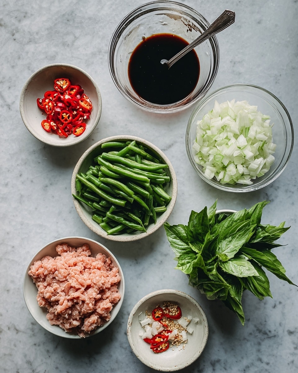 The image shows six bowls and dishes arranged on a white marbled surface. At the bottom left, there is a white bowl filled with soft light pink ground meat. Above it, a clear glass bowl contains a dark brown liquid with a metal spoon in it. To the right, a small white bowl holds bright green fresh basil leaves with visible veins. Above this, another clear glass bowl is filled with finely chopped white onions. To the top left, there is a round bowl with cut long green beans, each about the same size. At the very top, two small white dishes hold red and green chili peppers and a minced light mixture with bits of red chili mixed in. The colors are natural and fresh, with a contrast between the soft pink meat, dark sauce, bright green vegetables, and white onions. Photo taken with an iphone --ar 4:5 --v 7
