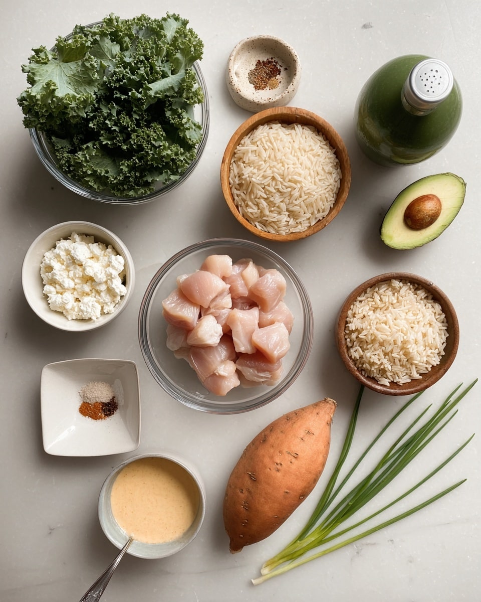 The image shows a white marbled surface with several ingredients neatly placed. At the center, there is a clear round bowl with raw light pink chicken cubes. Above it, slightly to the right, a wooden bowl holds cooked brown rice. To the right of the rice is a medium-sized orange sweet potato, and next to it is a whole dark green avocado. A small beige bowl nearby contains a mix of spices in colors white, red, and brown. To the left of the chicken bowl, a small white square dish holds crumbled white cheese. Above that, there is a glass bowl filled with fresh green kale leaves. A green bottle with a silver top is partly in the top-left corner. At the bottom left, a small white round bowl contains a light orange creamy sauce with a spoon inside. Finally, two long green chives lie diagonally on the bottom right corner. Photo taken with an iphone --ar 4:5 --v 7