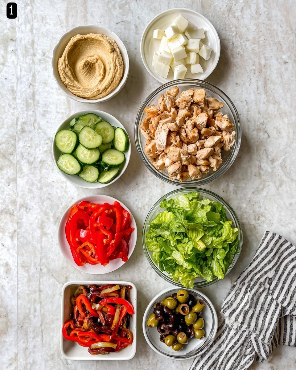 The image shows seven small bowls placed on a white marbled surface. Starting from the top left, there is a bowl filled with a smooth, creamy beige spread, followed by a small bowl with white chunks of cheese. Below that, a small white plate holds thinly sliced light green cucumber. In the middle, a larger glass bowl contains chopped, cooked chicken pieces with a slightly browned texture. To the right, a filled glass bowl has fresh, chopped bright green lettuce leaves. Below that, a white bowl is filled with sautéed red and brown bell pepper slices and onions. At the bottom left, a small white square bowl holds chopped red tomatoes, while next to it, a white bowl contains mixed green and black sliced olives. A cloth napkin with black stripes is seen at the bottom right corner. photo taken with an iphone --ar 4:5 --v 7