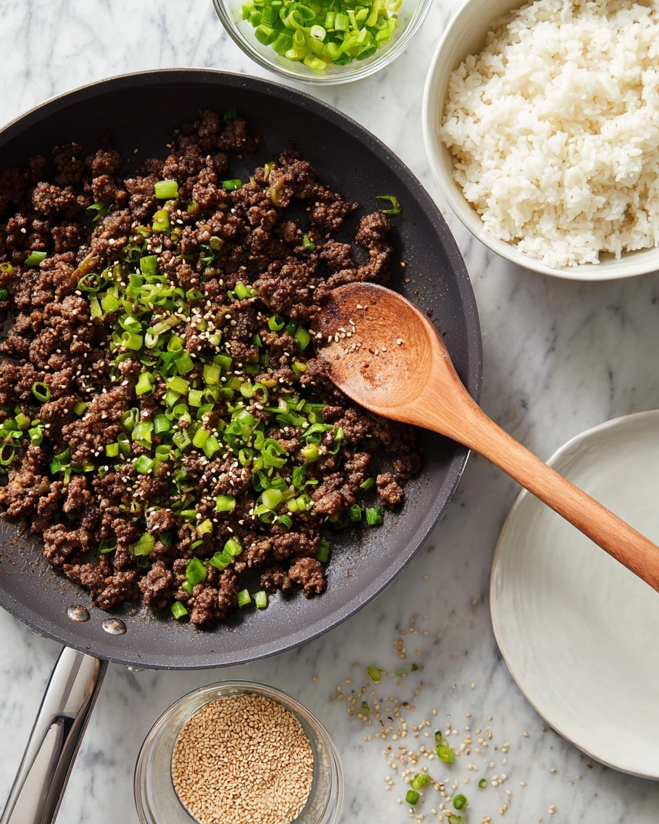 A black pan filled with dark brown cooked ground meat sprinkled with bright green chopped spring onions and light brown sesame seeds, with a light wooden spoon resting on the right side of the pan. Above the pan, a white bowl is filled with plain white rice. To the left, there is a small clear bowl holding more chopped spring onions. Below the pan, on the white marbled surface, is a small clear bowl filled with light brown sesame seeds, some scattered around it, and a white plate. The whole setup is on a white marbled surface. photo taken with an iphone --ar 4:5 --v 7