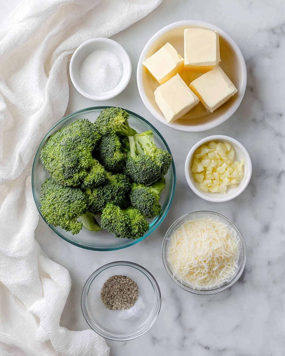 The image shows five small white bowls and one clear bowl on a white marbled surface with soft white cloths around. The clear bowl, placed at the bottom left, is filled with bright green broccoli florets, showing a rich texture of tiny buds and fresh stems. At the top right, a white bowl holds four thick cubes of pale yellow butter. Nearby, a white bowl contains finely chopped light yellow garlic with a moist texture. Next to it is a small clear bowl filled with coarse white salt grains, and another clear bowl has ground black pepper with a speckled texture. A white bowl near the bottom left features finely grated white cheese with a fluffy texture. The whole setup presents fresh ingredients on a clean, neat background photo taken with an iphone --ar 4:5 --v 7