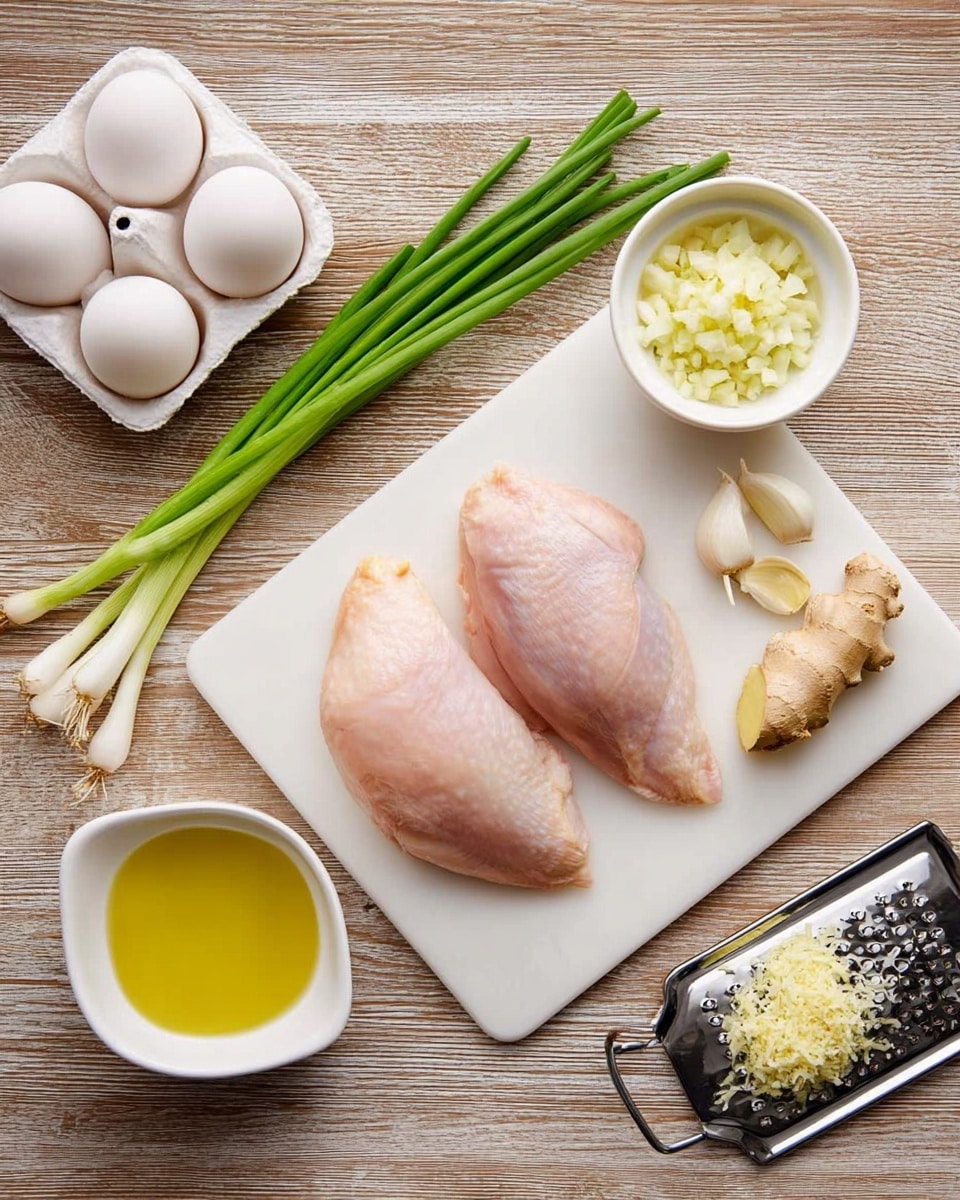 The image shows a white cutting board on a wooden surface with two raw chicken pieces placed side by side in the center. To the left of the chicken, there are three green onions pointing diagonally upward and a small white bowl filled with yellow oil below them. Above the chicken are two peeled garlic cloves and a small white bowl containing minced garlic. To the right of the chicken, there is a piece of ginger root and a white grater with grated ginger on it. On the wooden surface to the left of the cutting board, there is a carton holding three white eggs. The scene is clear and well-lit, with all items neatly arranged on a white marbled texture surface. photo taken with an iphone --ar 4:5 --v 7