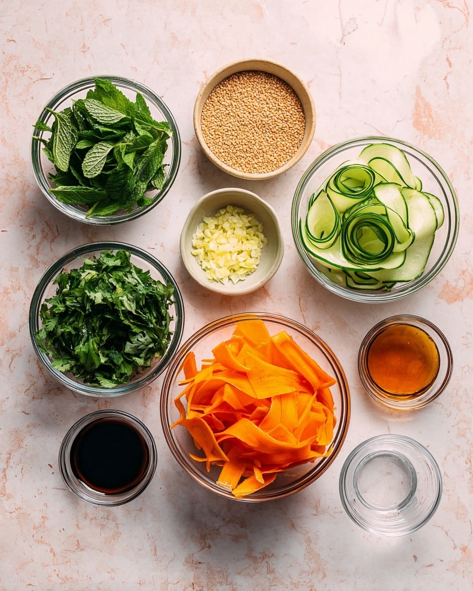 The image shows nine clear glass bowls arranged on a white marbled texture, each filled with different ingredients. In the center bottom, there is a bowl filled with thin, wide ribbons of bright orange carrot. To the right of it, a bowl contains thin, curled slices of light green cucumber with dark green edges. Above these vegetable bowls, a small beige bowl holds a layer of light brown sesame seeds. To the left, two bowls with green leafy herbs; the one on the top has large dark green mint leaves while the one below has flat green cilantro leaves with stalks. On the right side, three small bowls contain different sauces or liquids: a dark brown liquid in the top middle, a light amber liquid next to it on the right, and a darker amber liquid further right. There is also a very small bowl with light yellow minced garlic near the sesame seeds bowl, and an empty small clear glass bowl to the far right. The top-down photo is clean and bright, capturing all details sharply. Photo taken with an iphone --ar 4:5 --v 7