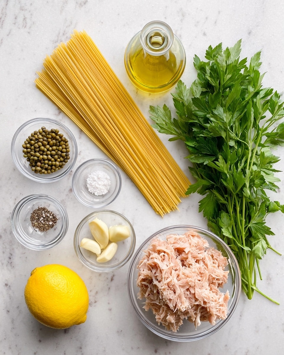 The image shows a clean, organized layout of ingredients for a pasta dish on a white marbled surface. At the center, there is a bundle of uncooked spaghetti with a pale yellow color. To the right of the spaghetti, a bunch of fresh parsley with bright green leaves is placed, and next to it, a clear glass bowl full of light pink shredded tuna. Above the tuna bowl, there is a glass bottle of olive oil with a light golden color. On the left side of the spaghetti, several small clear glass bowls contain spices and other ingredients: one bowl has green capers, one has white granulated salt and black pepper, one has three peeled garlic cloves, and one has finely grated pale yellow cheese. At the bottom left corner, there is a whole bright yellow lemon. The photo taken with an iphone --ar 4:5 --v 7