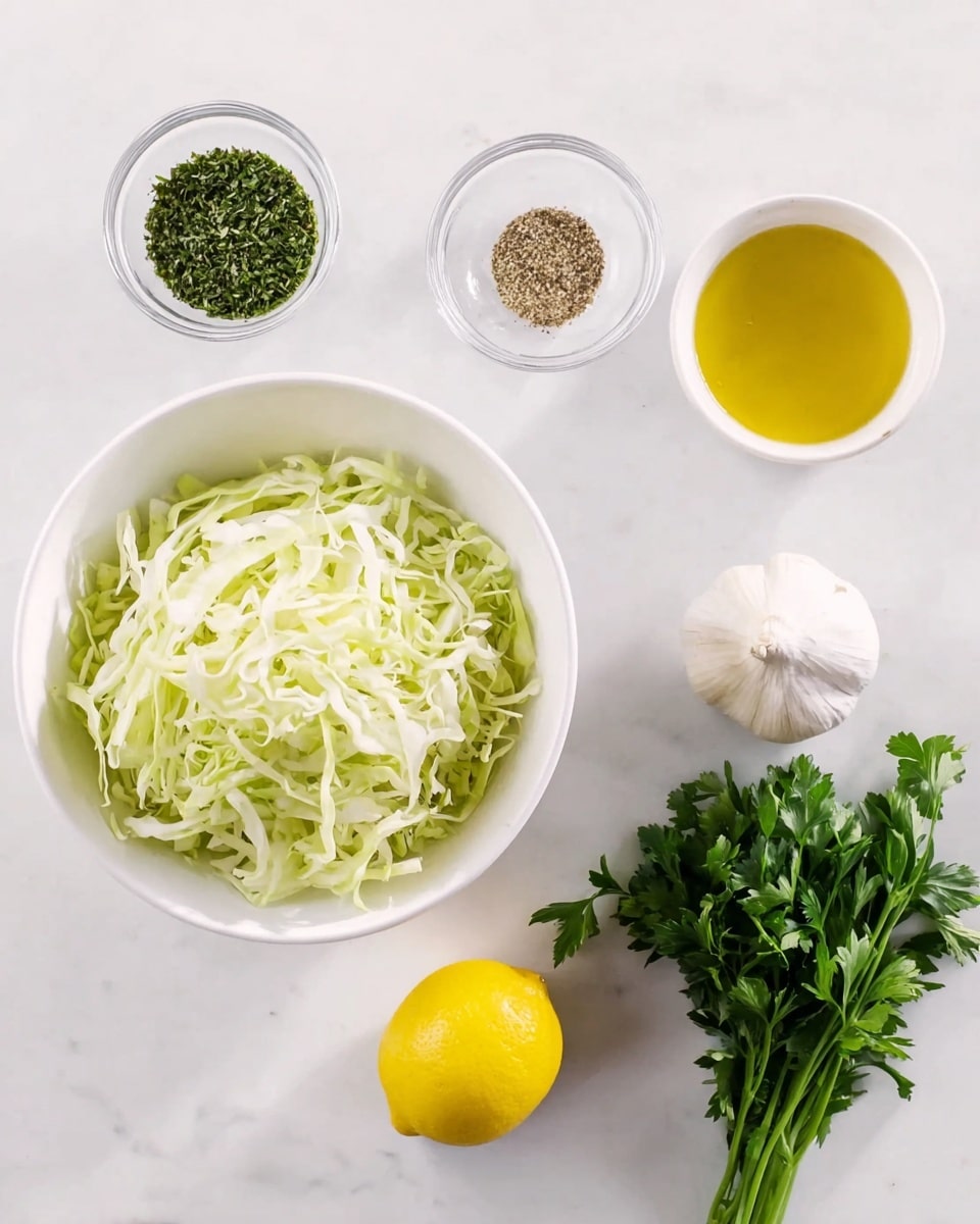 The image shows a top view of ingredients neatly arranged on a white marbled surface. At the center bottom, a white bowl is filled with shredded light green cabbage with a soft texture. Above it, a bunch of fresh, vibrant green leafy herbs rest loosely with some stems visible. To the left of the herbs, there is a whole yellow lemon, bright and smooth. Below the lemon, a small white bowl holds golden yellow olive oil with a shiny surface. To the left of the oil, a small clear glass container has a coarse green dried herb mixture. On the right side near the herbs, a whole white garlic bulb with a papery texture is placed. Below the garlic, a small clear bowl holds a seasoning mix of white salt and black pepper grains. The lighting is bright and natural, and a woman’s hand is not shown but implied from the arrangement. Photo taken with an iphone --ar 4:5 --v 7