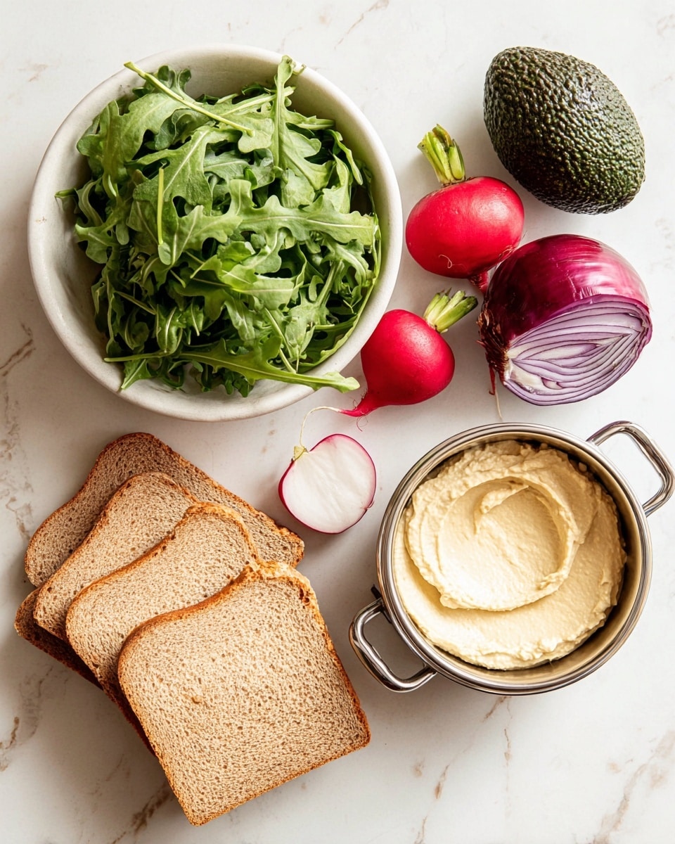 The image shows ingredients arranged on a white marbled surface: a white bowl filled with fresh green arugula leaves, three bright red radishes, one whole dark green avocado, and one small red pepper; near the bowl lies a halved purple onion with visible layers, and three slices of whole wheat bread stacked next to it; below these items is a small shiny metal bowl with two handles containing creamy white hummus with a smooth texture. photo taken with an iphone --ar 4:5 --v 7