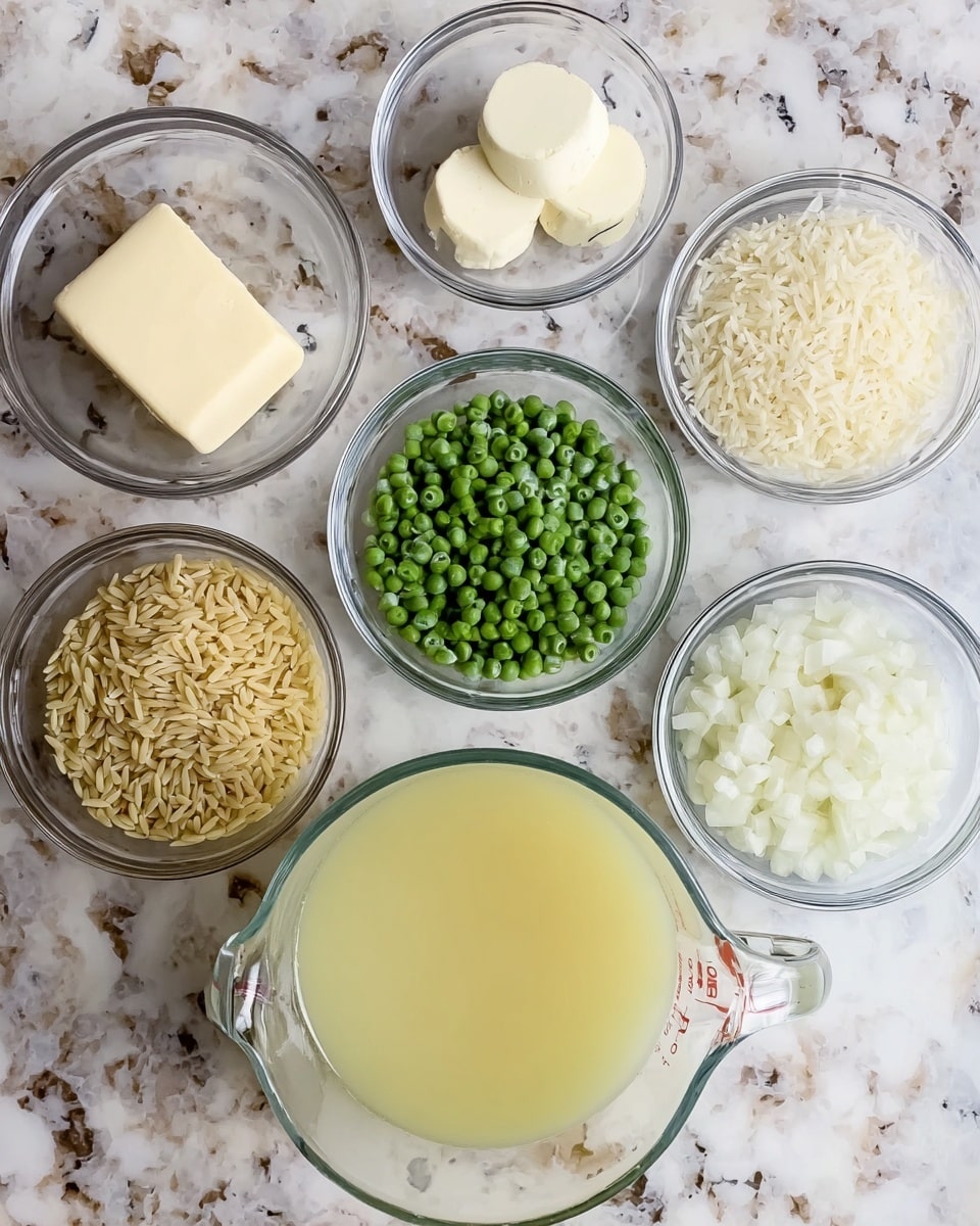 The image shows seven clear glass bowls placed on a white marbled surface. At the center bottom is a large glass measuring cup filled with pale yellow liquid broth. Surrounding it, from top left to bottom left, are six smaller bowls with different ingredients: two solid white and pale yellow butter pieces, raw orzo pasta with a light tan color, frozen green peas, diced white onions, finely minced garlic, and grated white cheese. Each ingredient is clearly visible with natural colors and textures. photo taken with an iphone --ar 4:5 --v 7