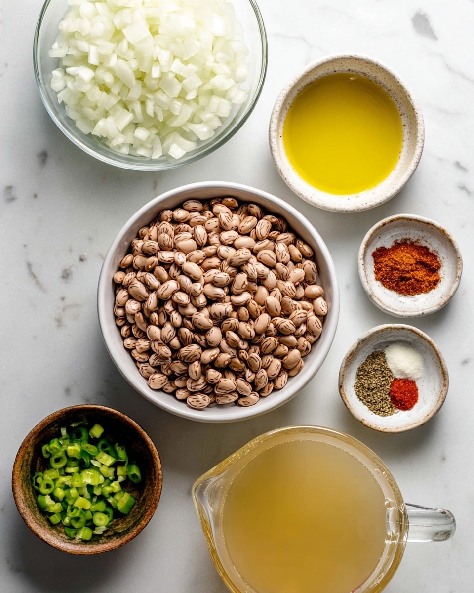 A flat lay image showing seven bowls of ingredients arranged on a white marbled surface. In the center, there is a medium white bowl filled with dry pinto beans, light brown with dark speckles. Above it to the left is a large clear glass bowl filled with chopped white onions. Above the beans to the right is a small white bowl containing golden yellow oil. Next to it on the far right is a small white bowl holding four spices: reddish paprika, brown cumin, black pepper, and white salt, each in neat piles. Below the beans on the left side is a small brown bowl with chopped green peppers. Below that is an even smaller rustic white bowl filled with minced garlic, pale yellow in color. To the lower right is a large clear glass measuring cup filled with a pale yellow liquid broth. All bowls rest on a smooth white marbled surface with soft natural light illuminating the scene photo taken with an iphone --ar 4:5 --v 7