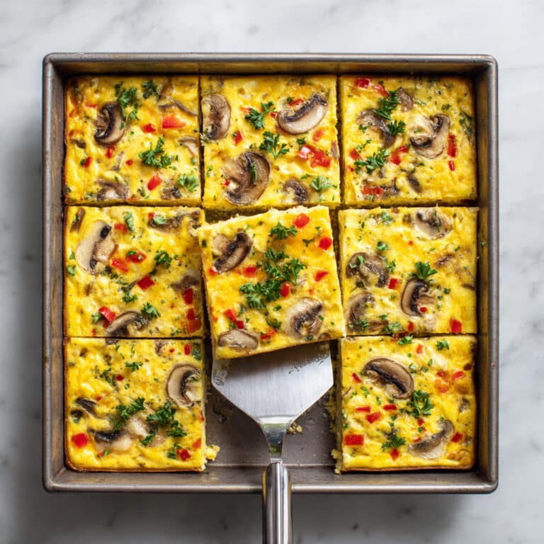 Sheet Pan Eggs with Mushrooms, Peppers, and Cheddar Recipe
