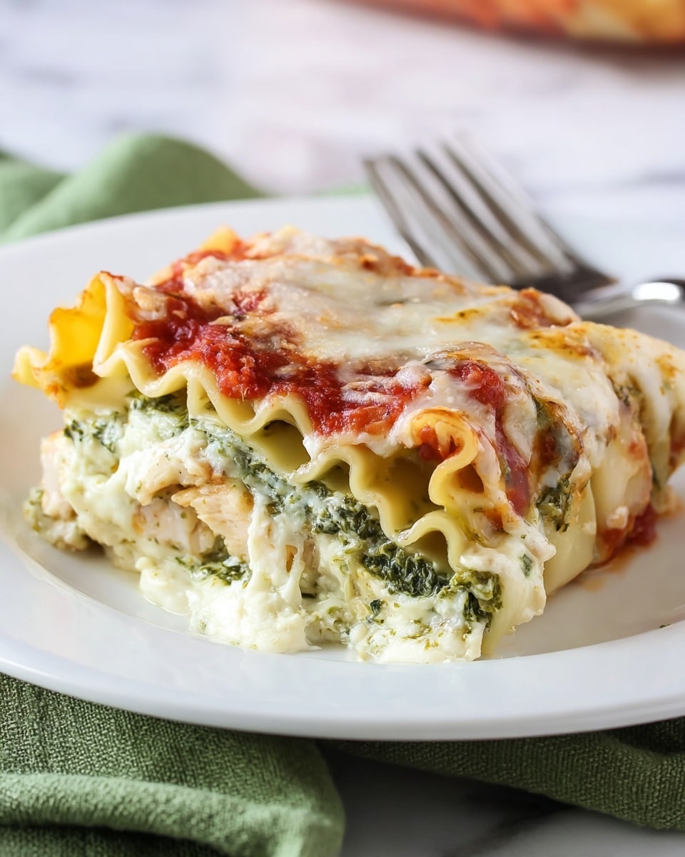 A close-up view of a piece of lasagna on a white plate with a silver fork behind it. The lasagna has multiple layers: the bottom layer is creamy white with a soft texture, above it is a green layer of spinach or pesto sauce, followed by yellowish wavy pasta sheets. On top, there is a layer of red tomato sauce and melted cheese with a slightly browned texture, showing some golden spots. The plate sits on a white marbled surface with a green cloth partially visible at the bottom. photo taken with an iphone --ar 4:5 --v 7