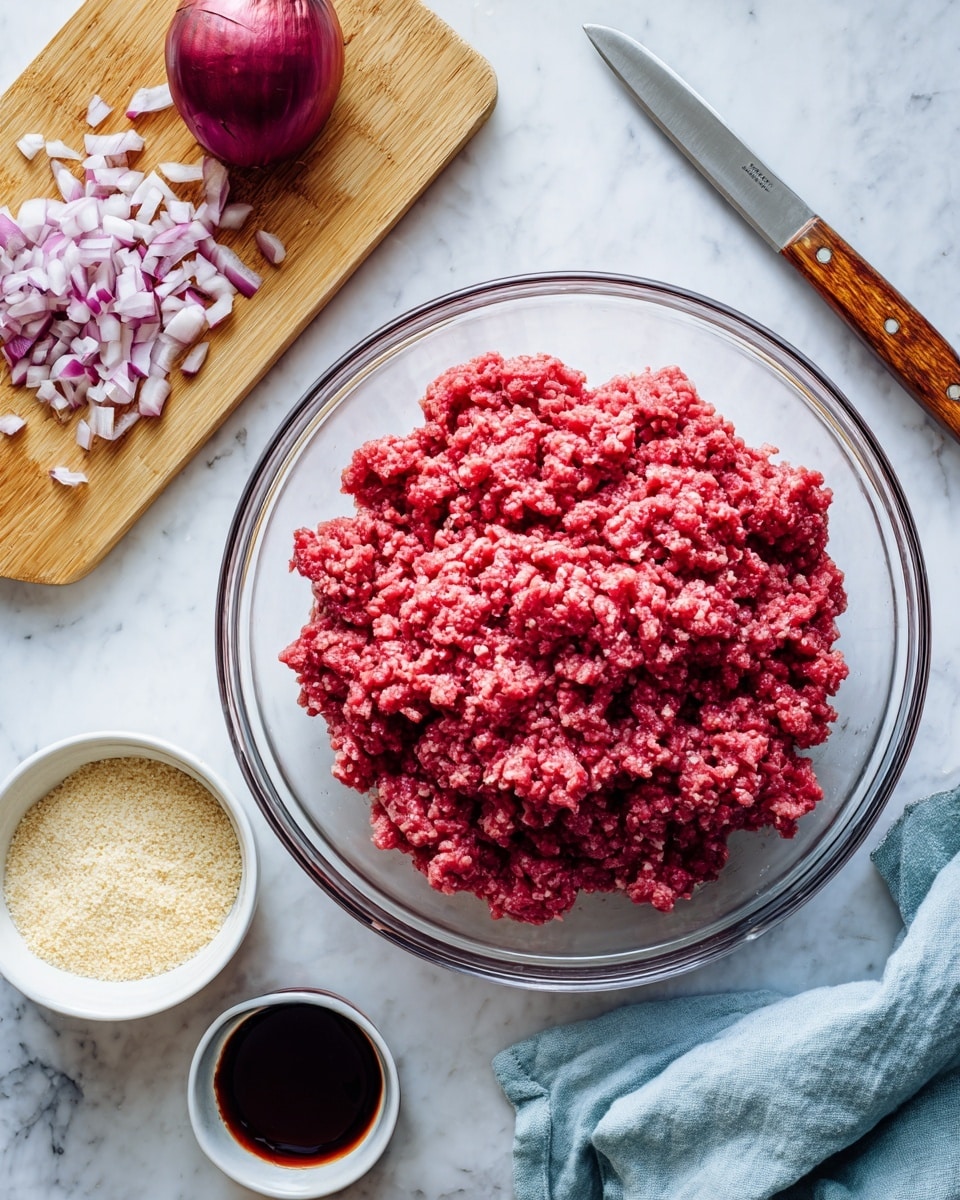 A large clear glass bowl filled with bright red ground meat sits on a white marbled surface. To the top right, there is a light brown wooden cutting board with a quarter of a red onion and many small red and white onion pieces. Next to the cutting board is a knife with a wooden handle. Below the bowl, there are two small white bowls; one contains light beige breadcrumbs and the other holds a dark brown sauce. A crumpled light blue cloth lies to the lower right. Photo taken with an iphone --ar 4:5 --v 7