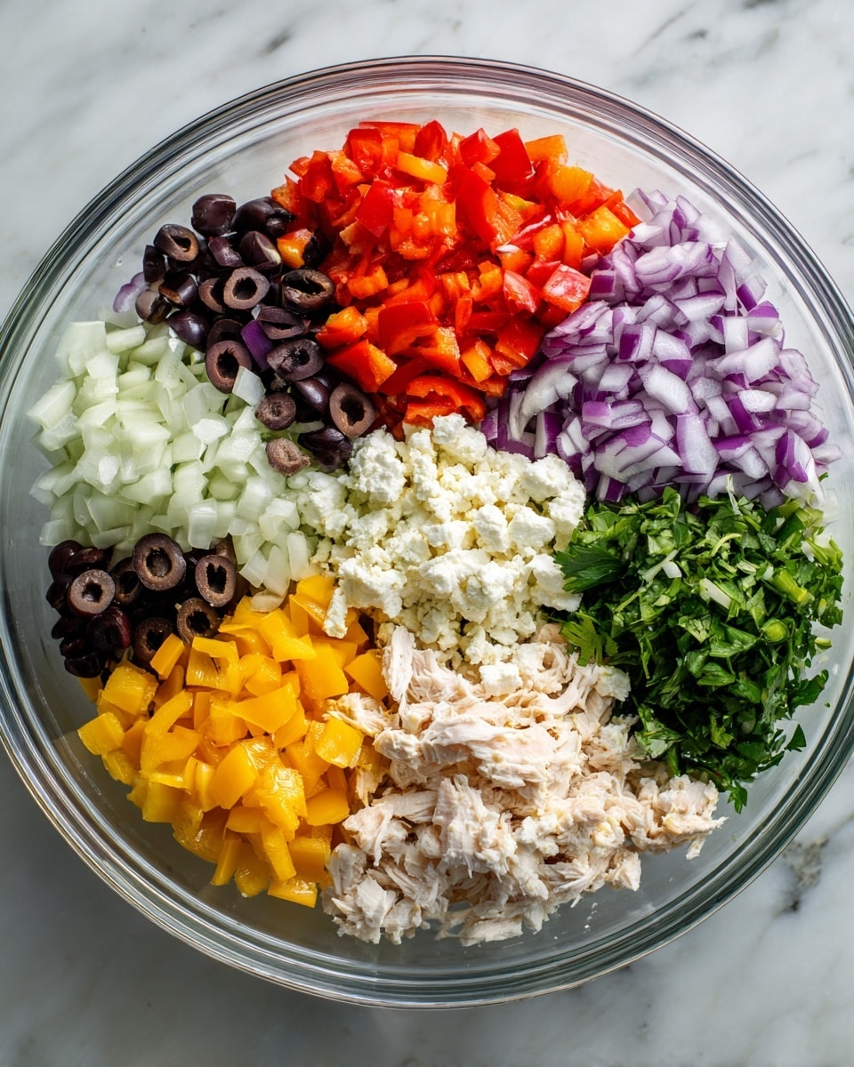 A clear glass bowl holds six separate piles of colorful salad ingredients arranged like slices in a pie. Starting at the top and moving clockwise, there are bright red diced bell peppers, purple diced onions, yellow diced bell peppers, sliced black olives, white crumbled cheese, shredded chicken, and chopped green leafy herbs. Each ingredient is neatly grouped, showing a mix of fresh textures and colors against the clean, white marbled texture beneath the bowl. photo taken with an iphone --ar 4:5 --v 7