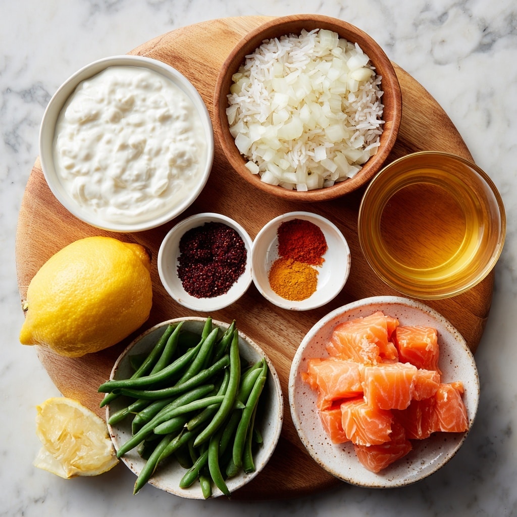 A round wooden board sits on a white marbled surface with multiple bowls placed on it, each containing different ingredients for cooking. The top left bowl is white and filled with thick, white yogurt showing a soft and creamy texture. To the right, a wooden bowl holds roughly chopped white onion pieces. Below the yogurt and onion are three smaller bowls: a white bowl with dark reddish-brown sumac powder, a small white bowl rimmed with orange holding three piles of spices in bright orange, red, and brown colors, and a beige bowl filled with off-white basmati rice placed on the bottom left. A large lemon with bright yellow color rests near the center on the board. At the bottom right, a white patterned bowl carries long, fresh green beans. Just below the lemon is a light grayish bowl stacked with bright orange-pink salmon chunks showing smooth, shiny textures. To the right of the salmon bowl is a glass filled with amber-colored broth, its smooth surface catching light. The whole setup looks bright, fresh, and inviting, arranged neatly for cooking. photo taken with an iphone --ar 4:5 --v 7