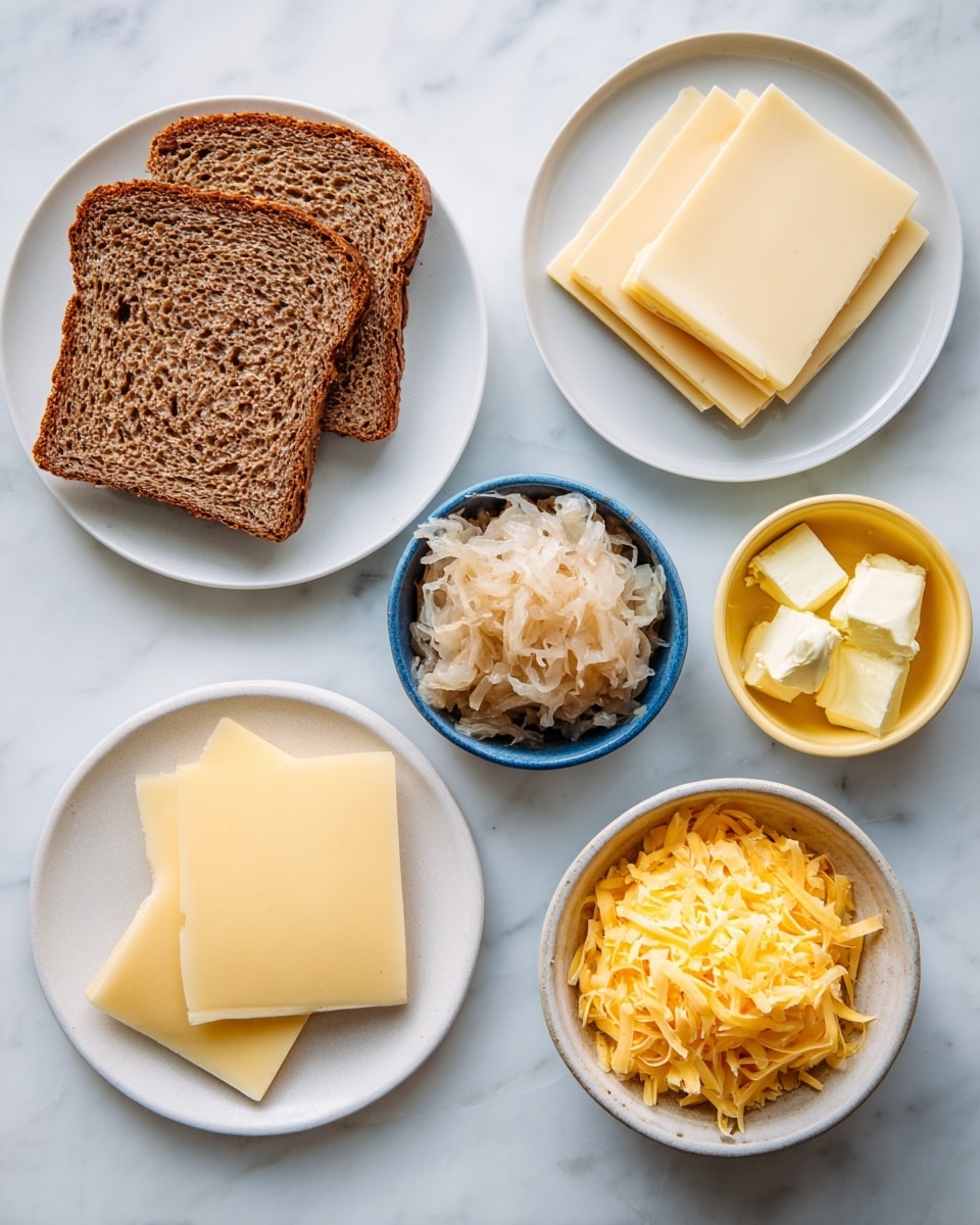 The image shows ingredients for a sandwich arranged on a white marbled surface. On the left side, there are two slices of rye bread with a textured, dark brown crust placed on a white plate. Below the bread, three square slices of pale yellow American cheese are stacked on another white plate. In the center, a small white bowl holds light brown sauerkraut with a soft, shredded look. To the right of the sauerkraut, there is a small blue bowl filled with creamy yellow dijon mustard. Above that, a small yellow bowl contains a few pieces of pale yellow butter. At the bottom right, a white bowl is filled with shredded, extra-sharp cheddar cheese that is a bright yellow color. The overall composition is neat, with each ingredient in its own container or plate, placed evenly spaced on the marbled surface. photo taken with an iphone --ar 4:5 --v 7