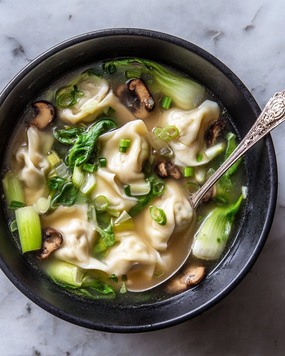 A white pot filled with clear brown broth containing several small dumplings that are pale beige with soft folds, floating near the top. Bright green leafy vegetables and light green chopped stems sit mostly at the bottom and sides, adding layers of color and texture. Thin slices of light brown mushrooms are scattered throughout the soup, and small rings of green onions float on the surface, enhancing the fresh look. The pot handles are visible on two sides, sitting on a white marbled surface. photo taken with an iphone --ar 4:5 --v 7