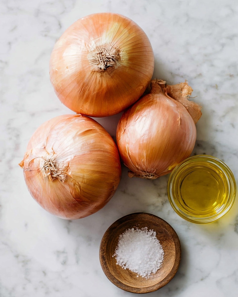 Four whole onions with light brown, slightly papery skins are placed closely together on a white marbled surface. To the right, there is a small clear jar filled with yellow oil, and below it, a small round wooden plate holds white salt arranged in a swirl pattern. The image has a clean and simple look, focusing on the natural texture and colors of the onions and ingredients. photo taken with an iphone --ar 4:5 --v 7