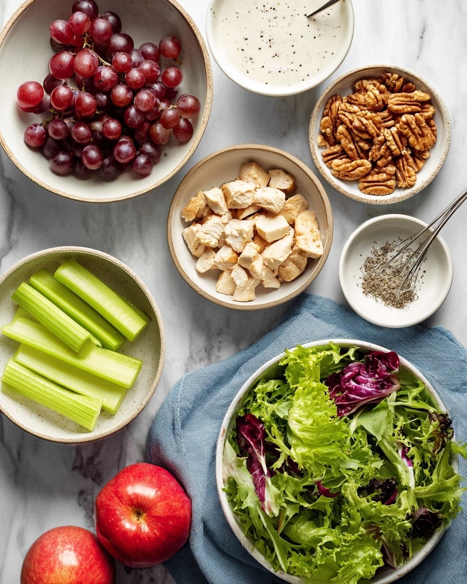 The image shows six white bowls and dishes on a white marbled surface. One bowl holds dark red grapes with shiny skins; another bowl has bright green slices of celery. A third bowl contains light and dark brown pieces of walnuts. There is a bowl filled with small chunks of cooked chicken, pale with some black pepper spots. Two shiny red apples rest between the bowls, glowing under the light. A large bowl holds fresh salad greens with deep purple and bright green leaves mixed. A white shallow bowl contains a creamy white sauce with black pepper specks, with a metal whisk inside it. A blue cloth is partly under the bowls and dishes. photo taken with an iphone --ar 4:5 --v 7