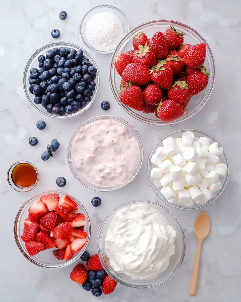The image shows six clear glass bowls placed on a white marbled surface. The largest bowl, at the center, is filled with whole and cut strawberries in bright red colors. Above it to the right is a bowl full of small white marshmallows with a soft, fluffy texture. To the left of the strawberries is a bowl of dark blue blueberries, round and smooth. Above the blueberries, a bowl contains light pink creamy yogurt with small strawberry pieces mixed inside. Below the blueberries is a smaller bowl filled with white powdered sugar, soft and fine in texture. At the bottom right, a bowl holds thick white whipped cream with a wooden spoon placed inside. Around the bowls are scattered blueberries, halved strawberries, and a small glass bowl of light brown vanilla extract. The setting is bright and clean, all items arranged neatly on the white marbled background. Photo taken with an iphone --ar 4:5 --v 7