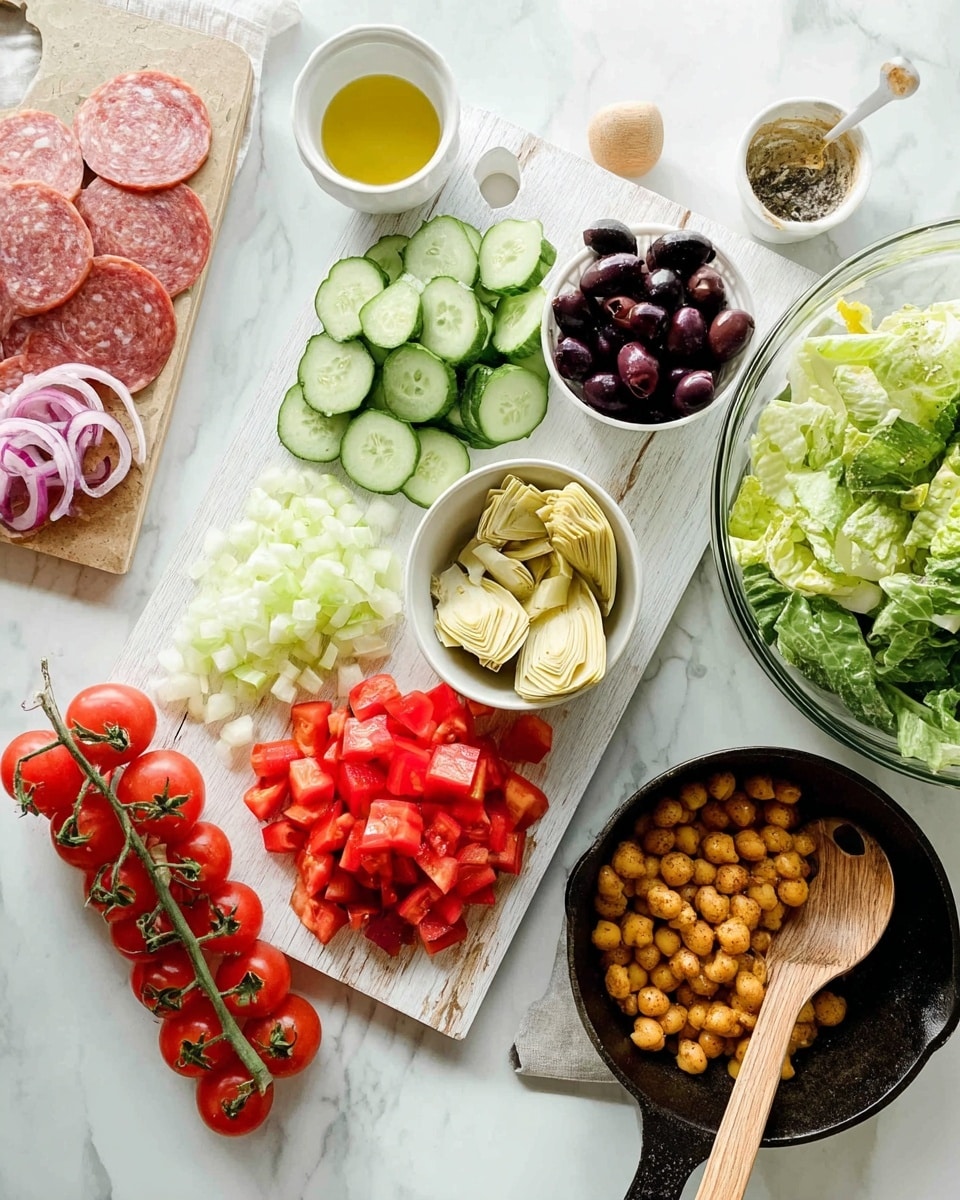 A white wooden board holds chopped fresh vegetables and olives arranged in groups: at the bottom left, light green cucumber slices, above them chopped red tomatoes, and to the right, dark purple olives halved. Below the olives, a small white bowl is filled with pale yellow artichoke hearts. Nearby, a small white bowl contains a yellow dressing, while a bunch of ripe red cherry tomatoes on their vine lies on the board's left side. To the left of the board, thinly sliced pinkish salami is laid out on a white marbled surface. On the right side of the image, a clear glass bowl contains a green leafy salad with romaine lettuce and thin onion slices. At the bottom right, a black cast iron skillet holds golden brown cooked chickpeas with spices, and a wooden spoon rests in the skillet. The whole scene is set on a white marbled texture. photo taken with an iphone --ar 4:5 --v 7