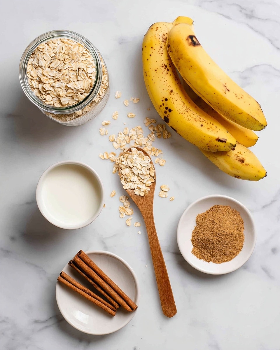 A clear glass jar filled with light brown rolled oats sits near the top left on a white marbled surface, with a wooden spoon holding some oats spilling out in front of it. Next to the oats are two yellow bananas with some brown spots, placed slightly overlapping each other. Below the bananas is a small white cup filled with milk. Near the bottom center, there is a white bowl with a creamy white substance inside and, to the left, a small white plate holding brown cinnamon powder with two cinnamon sticks nearby. To the right, there is another small white plate filled with a coarse ground brown spice, with a wooden spoon resting on it. photo taken with an iphone --ar 4:5 --v 7
