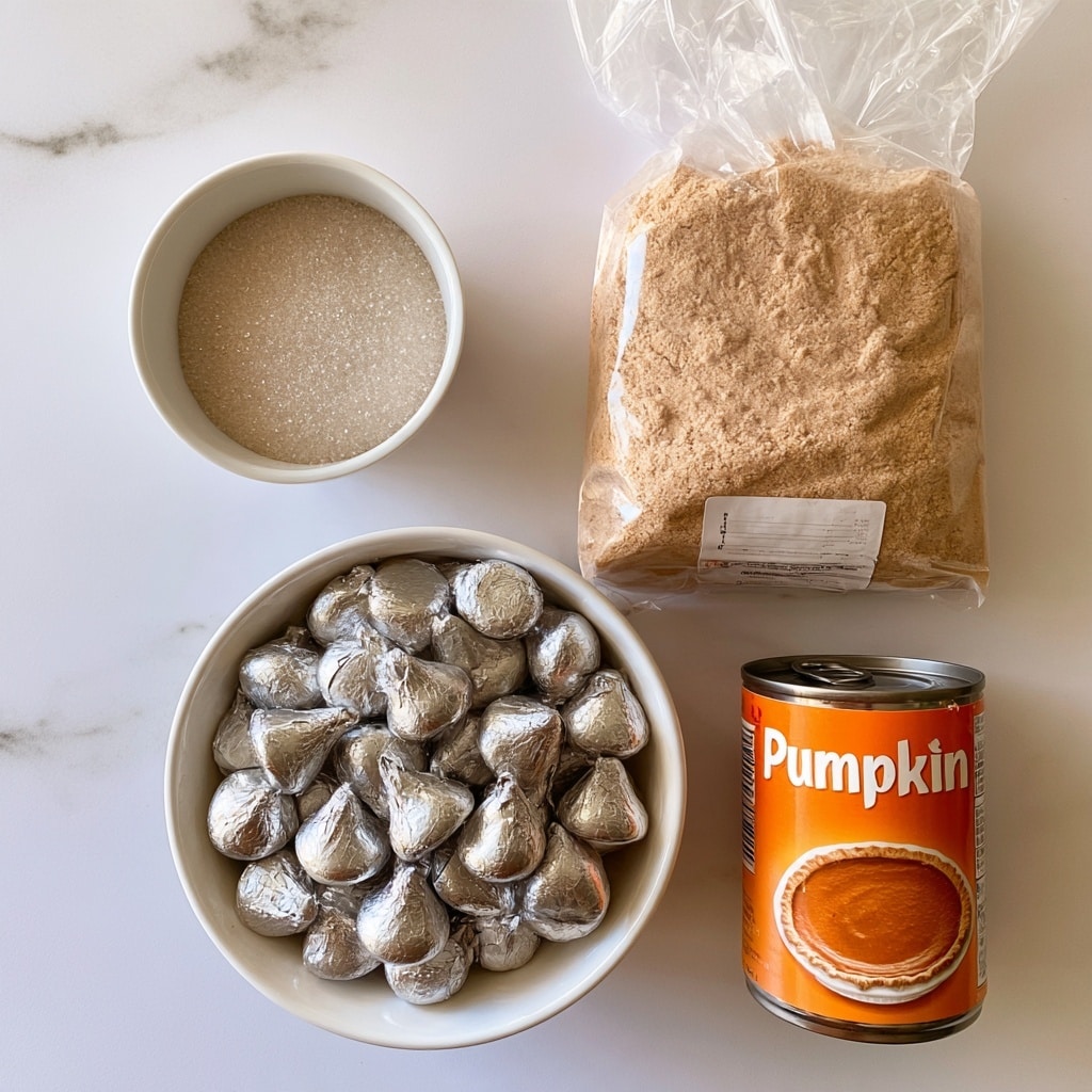 The image shows four baking ingredients arranged on a white marbled surface. On the top left, a small white bowl filled halfway with sparkling sugar crystals has a label floating above it. To the right, there is a clear plastic bag full of light brown spice cake mix with a label on the front. Below the sugar, a white bowl is filled with silver foil-wrapped Hershey Kisses chocolates, shiny and piled high. To the right of the Hershey Kisses, there is an orange can of canned pumpkin purée with a photo of pumpkin pie on its label. Each item is clearly labeled with bold text. photo taken with an iphone --ar 4:5 --v 7