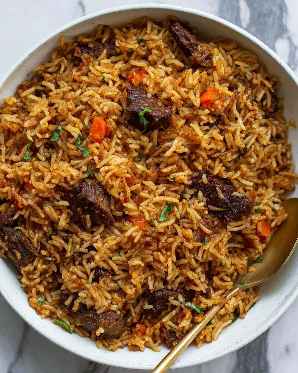A close-up view of a white bowl filled with seasoned rice mixed with small orange carrot pieces and dark brown chunks of meat, showing different shades of brown with some green herb bits scattered through the dish. The rice grains have a slightly oily texture and are rich in color from the spices. A golden metal spoon is placed at the bottom right of the bowl, partially covered by the rice on a white marbled surface. photo taken with an iphone --ar 4:5 --v 7